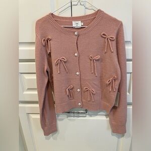 Luna Ivy pink bow sweater with pearl buttons